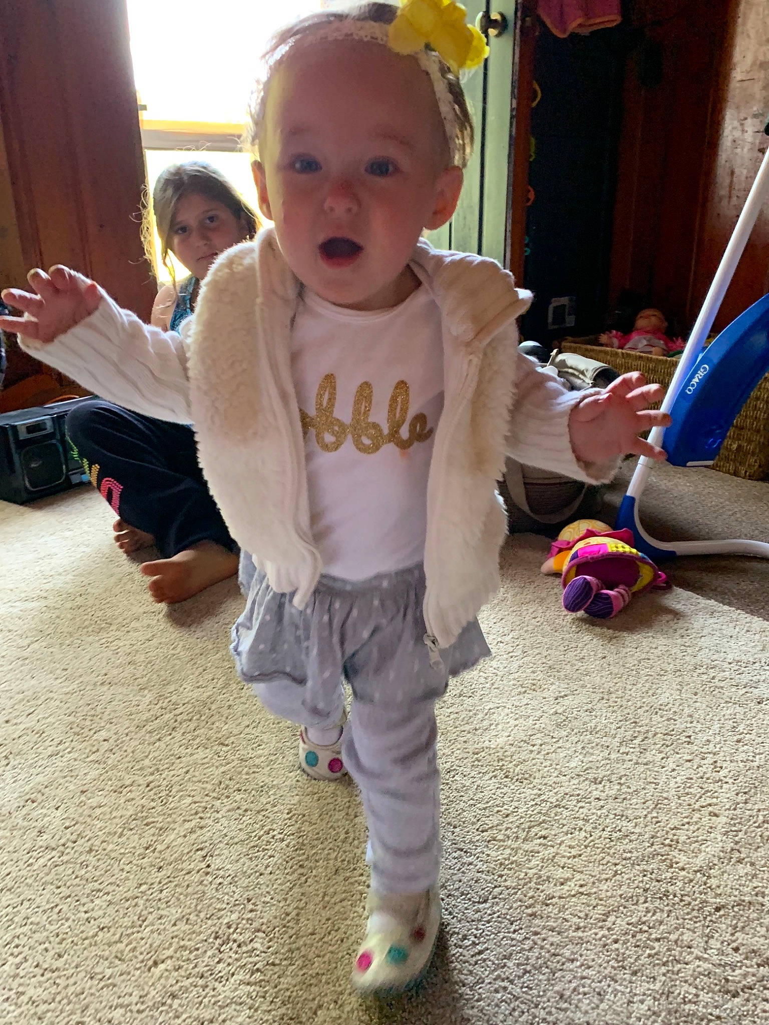 Sarah joined the competition — help win amazing prizes! baby, cheek, child, footwear, fun, head, leg, outerwear, person, play, shoe, skin, smile, standing, surprise, t_shirt, toddler, vacation