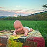 Austin is registered to the contest to win money with this photo: baby, tummy_time, diaper, blanket, grass, outdoor, field, sunset, sky, hill, nature, infant, child, cute, portrait, greenery, young, expression, daylight, scenery