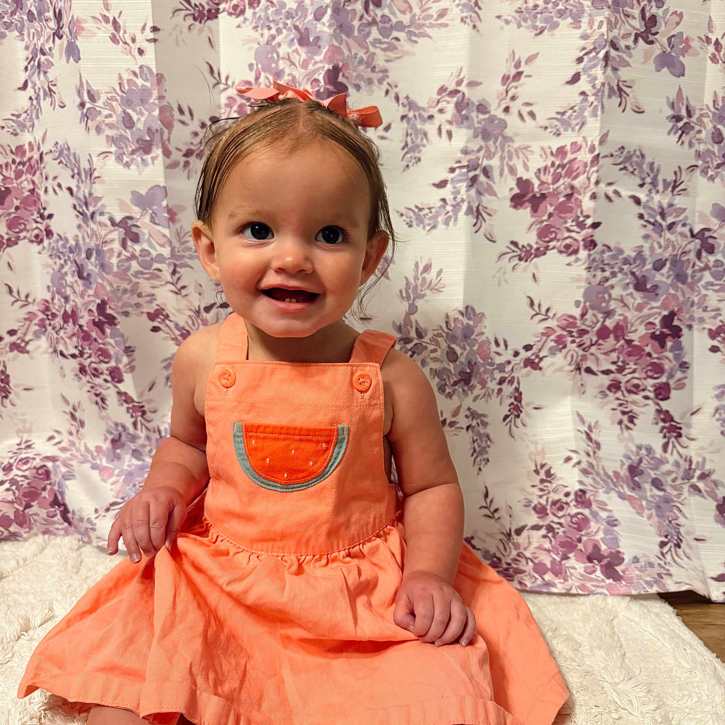 Alannah Carol is registered to the contest to win money with this photo: toddler, child, smiling, orange_dress, watermelon_patch, hair_bow, sitting, soft_rug, floral_backdrop, indoors, cute, happy, portrait, baby, young_child, colorful_clothing, bright_colors, adorable, person, photography
