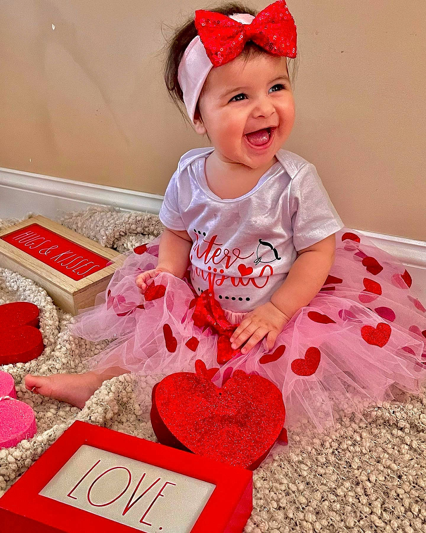 Samara is registered to the contest to win money with this photo: baby, baby_toddler_clothing, cap, carmine, child, costume_hat, fashion_accessory, fun, happy, headwear, magenta, party_supply, pattern, peach, person, pink, red, sleeve, smile, t_shirt