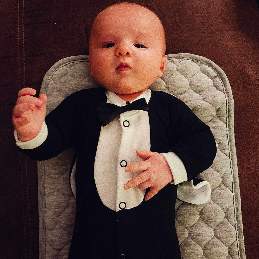 Hayes joined the competition — help win amazing prizes! accessories, baby, blazer, bodypart, clothing, coat, couch, cushion, face, finger, formalwear, furniture, head, homedecor, jacket, person, photography, portrait, suit, tie