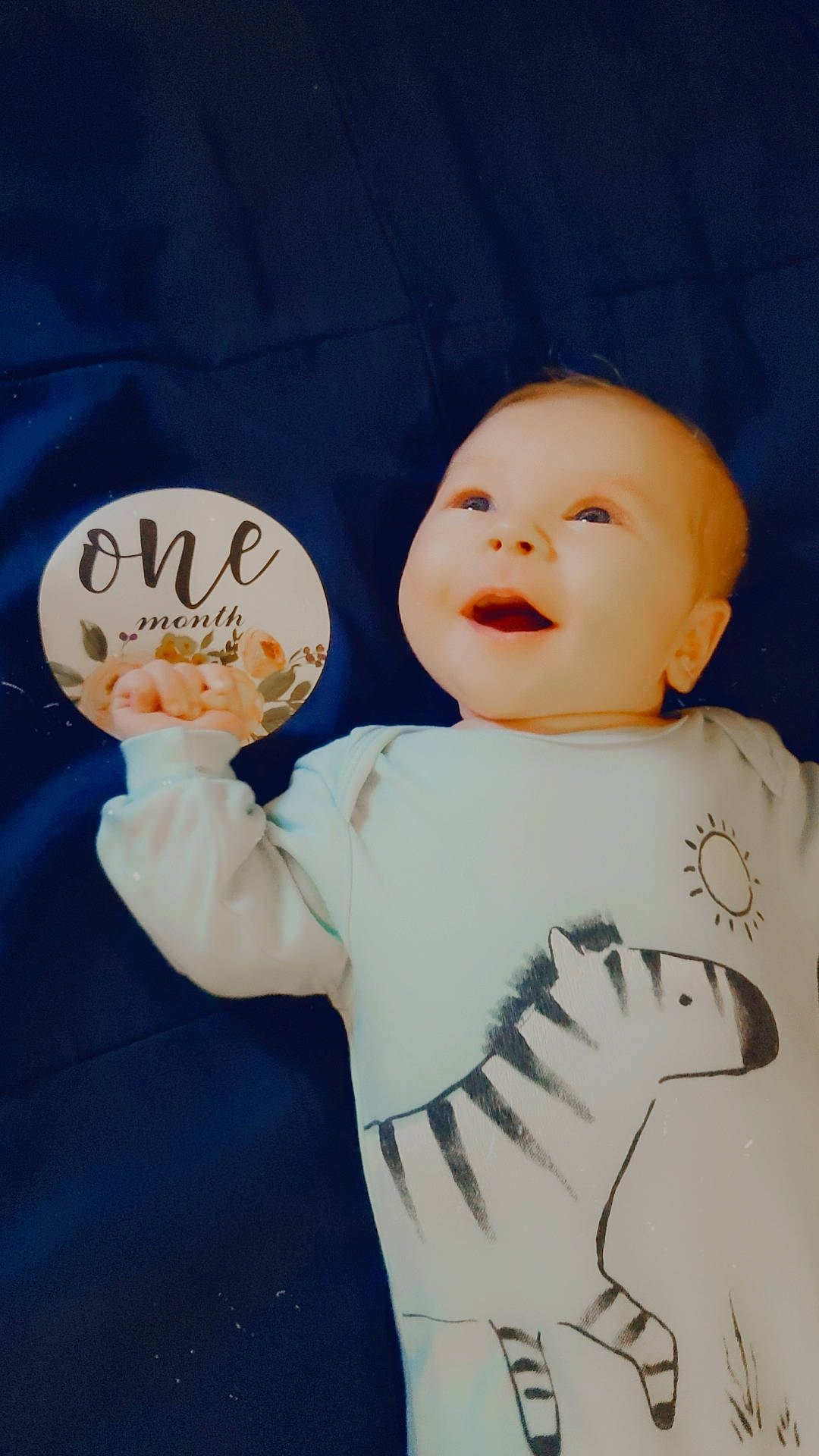 Eliza is registered to the contest to win money with this photo: art, baby, baby_toddler_clothing, cheek, child, cool, design, face, finger, font, gesture, handwriting, happy, outerwear, person, sleeve, smile, t_shirt, textile, thumb