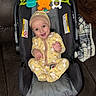 Kingstone joined the competition — help win amazing prizes! baby, car_seat, yellow_pajamas, toy, couch, blanket, infant, smiling, headwear, indoor, child, happy, seat, face, floor, wooden_floor, plaid_blanket, leather_couch, cute, playtime