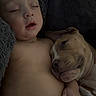 baby, child, puppy, dog, sleeping, cuddle, blanket, diaper, cozy, rest, nap, infant, pet, companion, cute, tender, warm, indoor, relax, peaceful