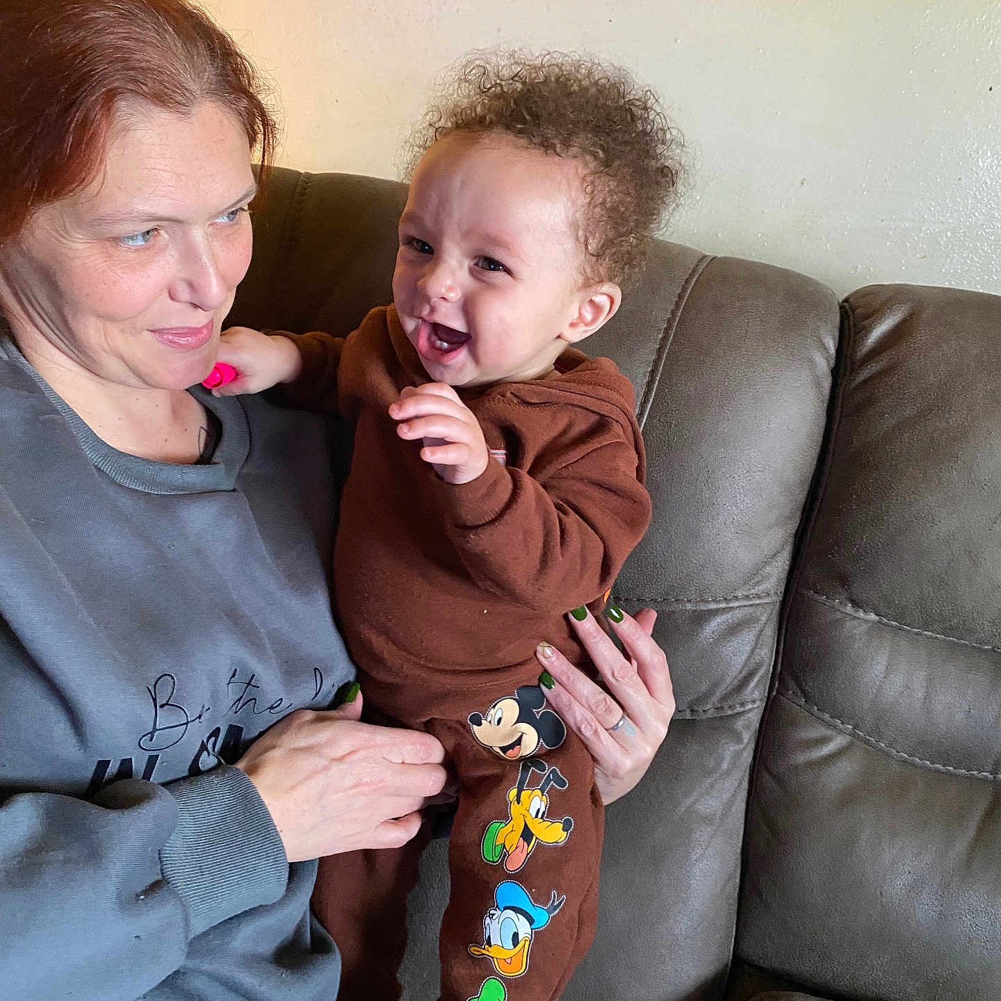 Kingstone joined the competition — help win amazing prizes! child, woman, toddler, smile, happy, couch, indoor, clothing, cartoon_characters, curly_hair, holding, person, casual, sweatshirt, leather_furniture, family, playful, portrait, skin, hand