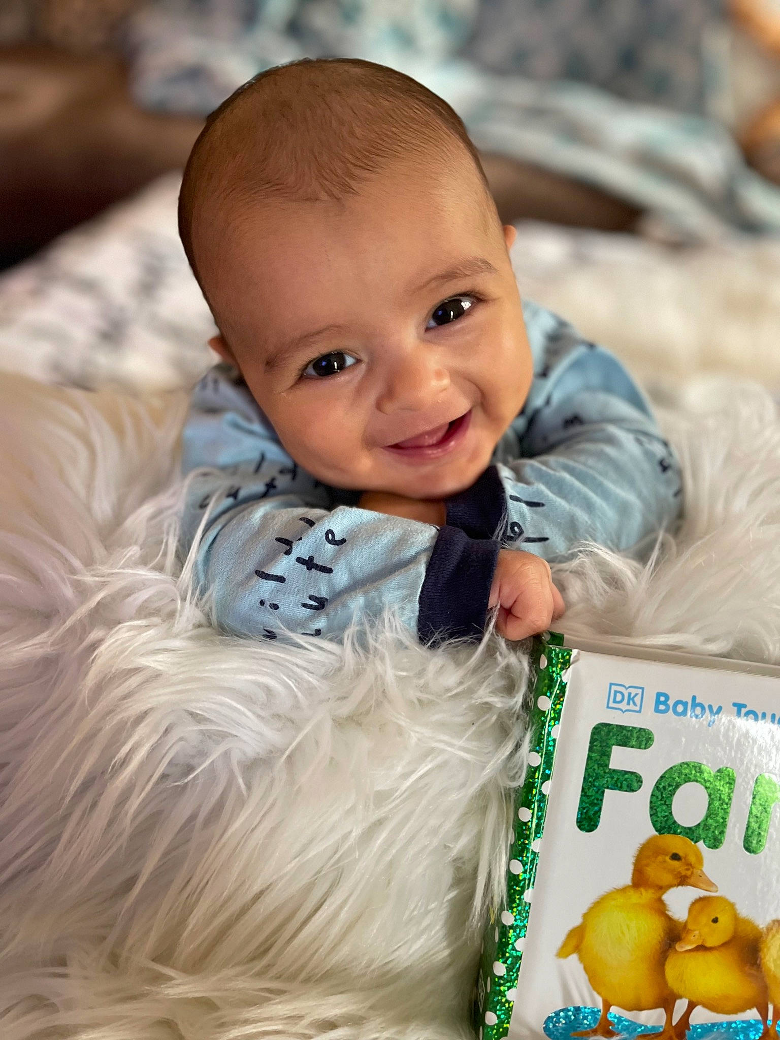 Thomas is registered to the contest to win money with this photo: baby, child, face, flash_photography, fun, fur, grass, green, happy, human_body, laugh, mammal, people_in_nature, person, portrait_photography, sitting, skin, smile, toddler, vertebrate