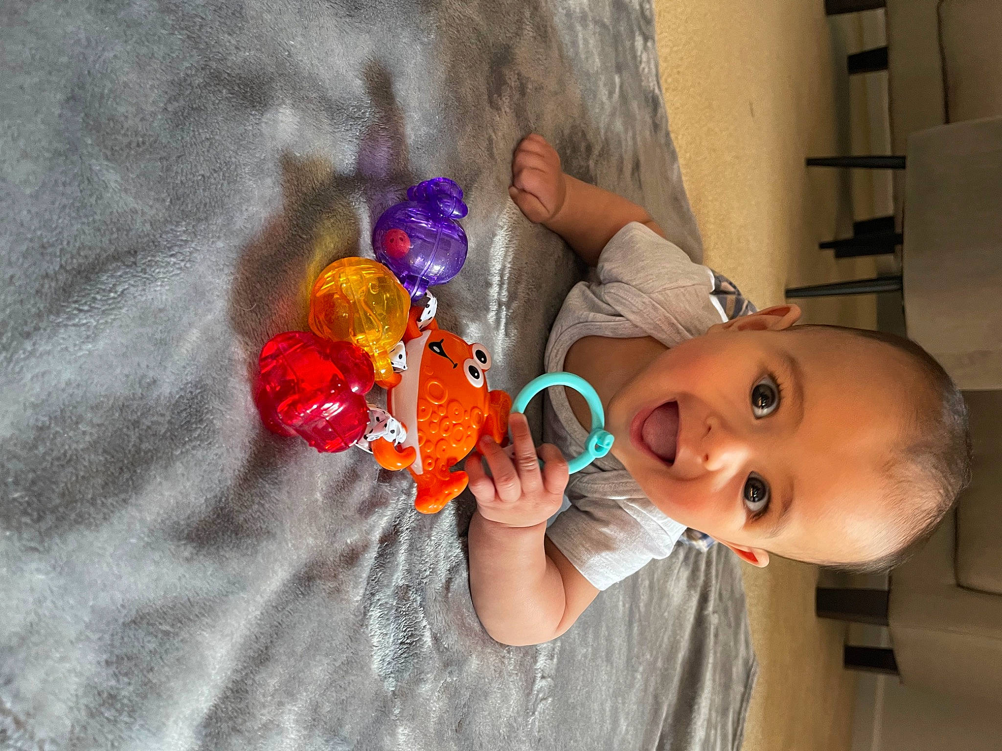 Thomas is registered to the contest to win money with this photo: arm, baby, baby_products, baby_toddler_clothing, baby_toys, child, electric_blue, fun, hand, happy, nail, paint, person, play, surprise, thumb, toddler, toy