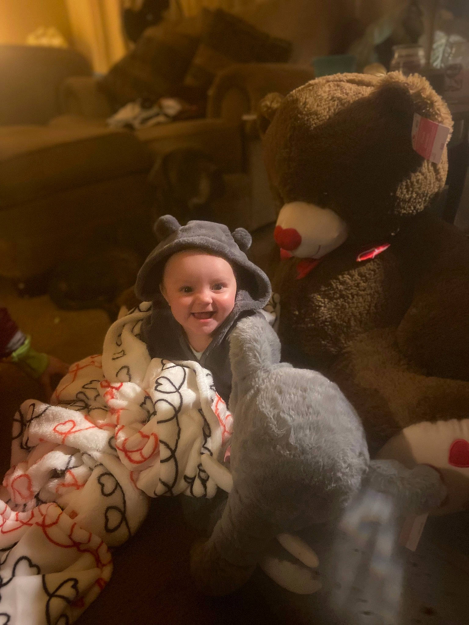 Journee joined the competition — help win amazing prizes! baby, child, comfort, event, fun, fur, happy, hat, head, headwear, human_body, interaction, joy, person, plush, room, skin, smile, stuffed_toy, teddy_bear