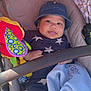 Alijah is registered to the contest to win money with this photo: baby, child, stroller, hat, denim_hat, blue_outfit, stars, plush_toy, blanket, infant, cute, smiling, baby_clothing, baby_accessory, baby_toy, baby_blanket, seated, indoors, comfort, portrait