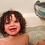 bath, bathtub, child, child_in_bath, curly_hair, cute, face, happy, indoor, joyful, playful, portrait, shoulders, skin, smiling, teeth, toddler, water, wet_skin, young_child