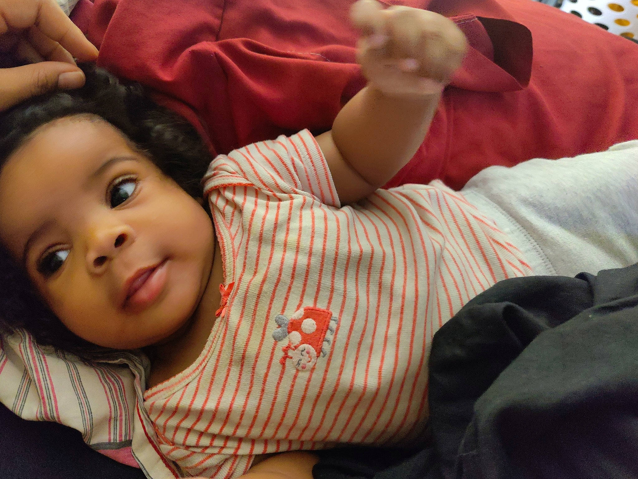 Leah is registered to the contest to win money with this photo: baby, cheek, child, comfort, elbow, fun, gesture, happy, linens, lip, mouth, neck, nose, person, portrait_photography, room, sitting, skin, smile, toddler