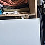 Cajou a rejoint le concours — aidez-le/la à gagner de superbes lots ! cat, closet, drawer, clothes, folded_clothes, curious, peeking, wood, shelf, indoor, pet, feline, hidden, mischievous, eyes, home, storage, wardrobe, curiosity, domestic