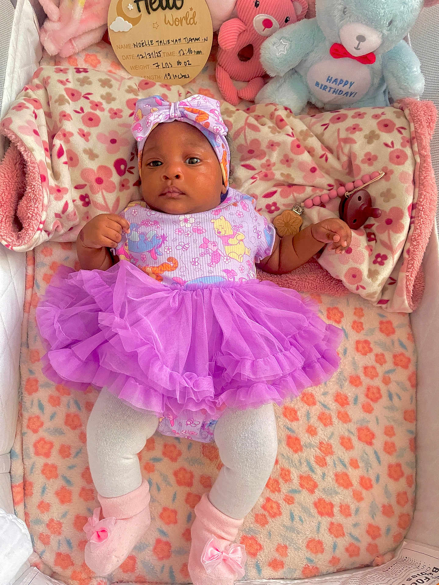 Noelle joined the competition — help win amazing prizes! adorable, baby, bed_linens, blanket, bow, crib, floral_pattern, headband, infant, onesie, pacifier, pink_palette, pink_socks, plush_toy, portrait, purple_tutu, soft_toys, stuffed_bear, toddler, wooden_sign