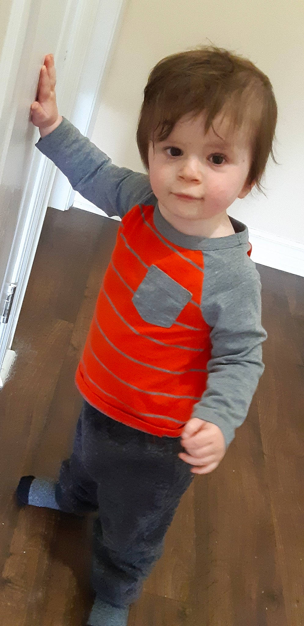 Lynkin is registered to the contest to win money with this photo: child, floor, outerwear, person, play, shoulder, sleeve, standing, t_shirt, toddler