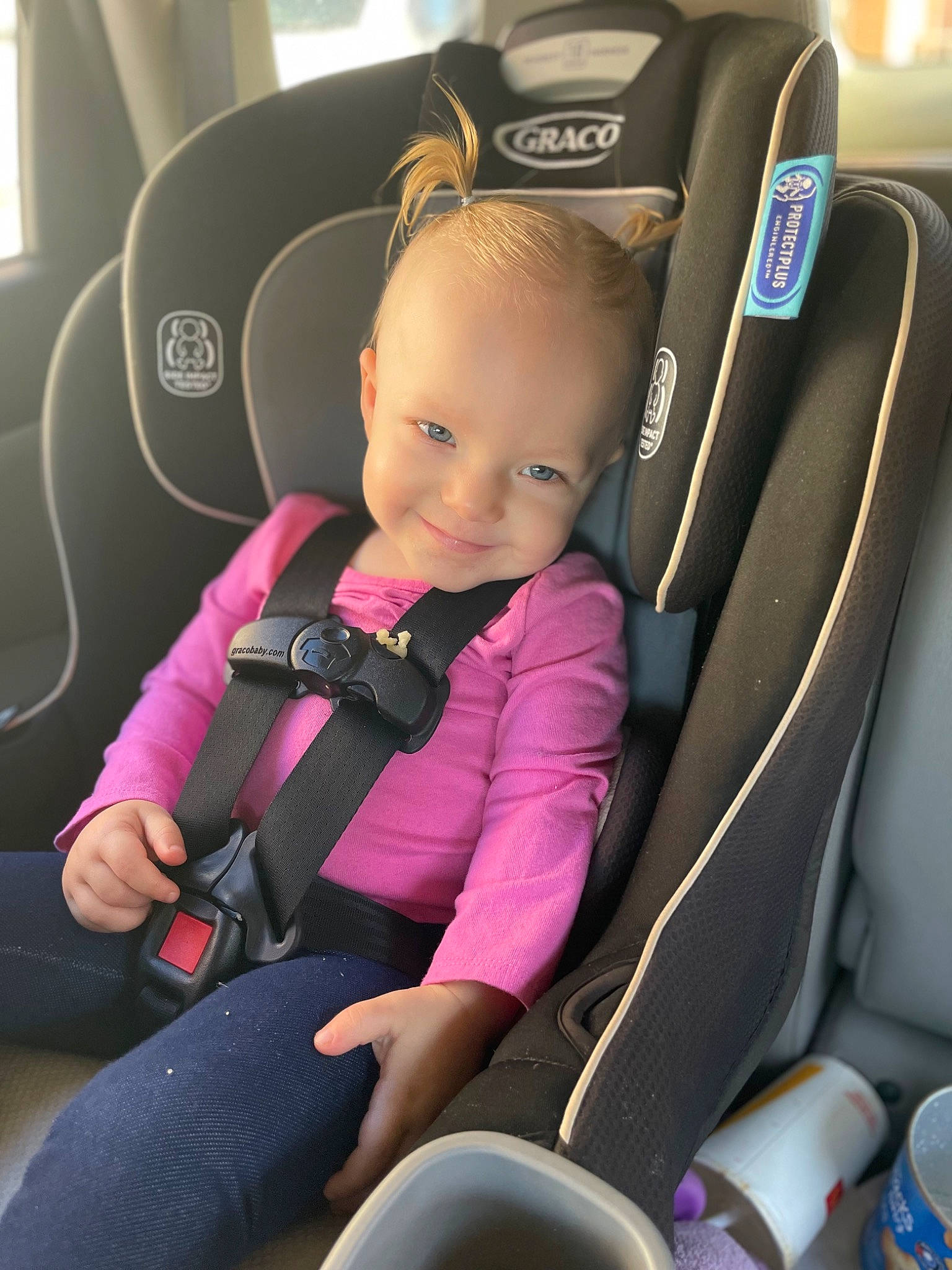 Brinley is registered to the contest to win money with this photo: auto_part, automotive_design, baby_carriage, baby_in_car_seat, car, car_seat, car_seat_cover, child, comfort, family_car, head_restraint, joy, luxury_vehicle, motor_vehicle, person, seat_belt, smile, steering_part, steering_wheel, toddler