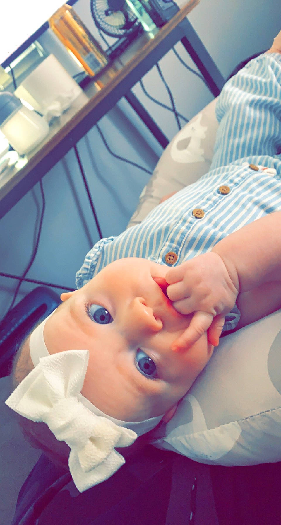 Blake is registered to the contest to win money with this photo: abdomen, baby, cheek, child, comfort, event, eyelash, finger, gesture, hat, headwear, medical_equipment, medical_procedure, mouth, nail, nose, person, room, service, skin