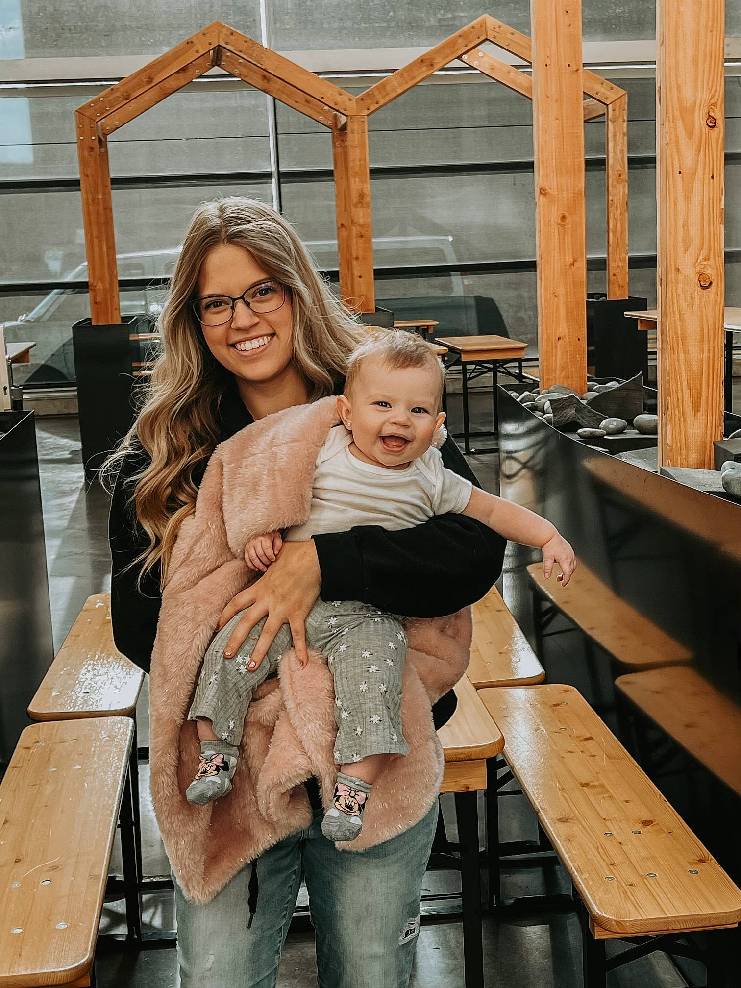 Blake is registered to the contest to win money with this photo: bench, blond, child, event, eyewear, flash_photography, fun, happy, human_leg, joy, leisure, luggage_and_bags, person, portrait_photography, room, sandal, sitting, smile, thigh, toddler