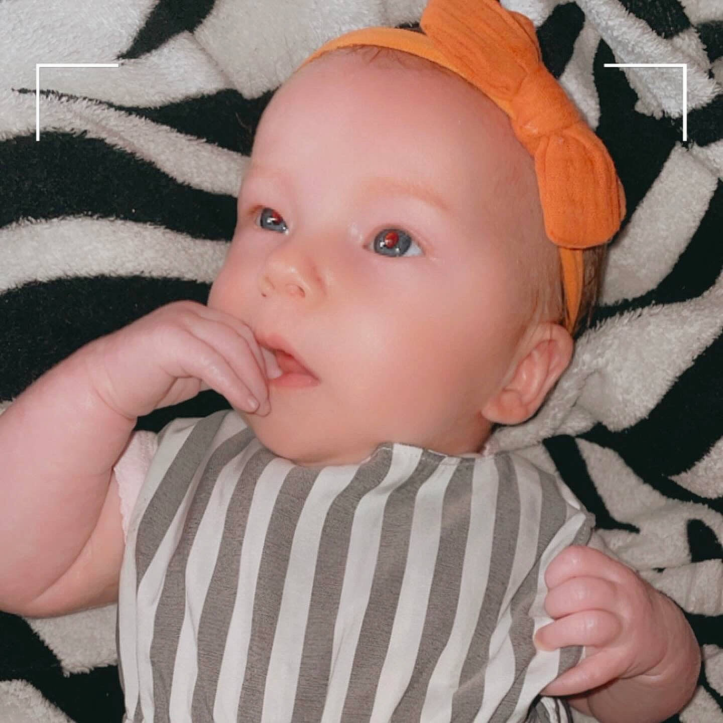 Bexley is registered to the contest to win money with this photo: baby, baby_products, baby_toddler_clothing, cheek, child, ear, eyebrow, eyelash, finger, gesture, happy, iris, lip, nose, pattern, person, skin, sleeve, textile, thumb