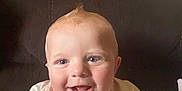 Ray is registered to the contest to win money with this photo: baby, child, smiling, happy, toddler, face, couch, indoor, short_hair, light_skin, clothing, sitting, cute, portrait, infant, young_child, expression, person, casual, home