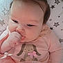 baby, infant, child, pink_clothing, tutu, bunny_design, pigtails, thumb_sucking, cute, adorable, star_pillow, soft_toys, closeup, portrait, indoor, sleeping_area, baby_girl, cozy, baby_outfit, happy