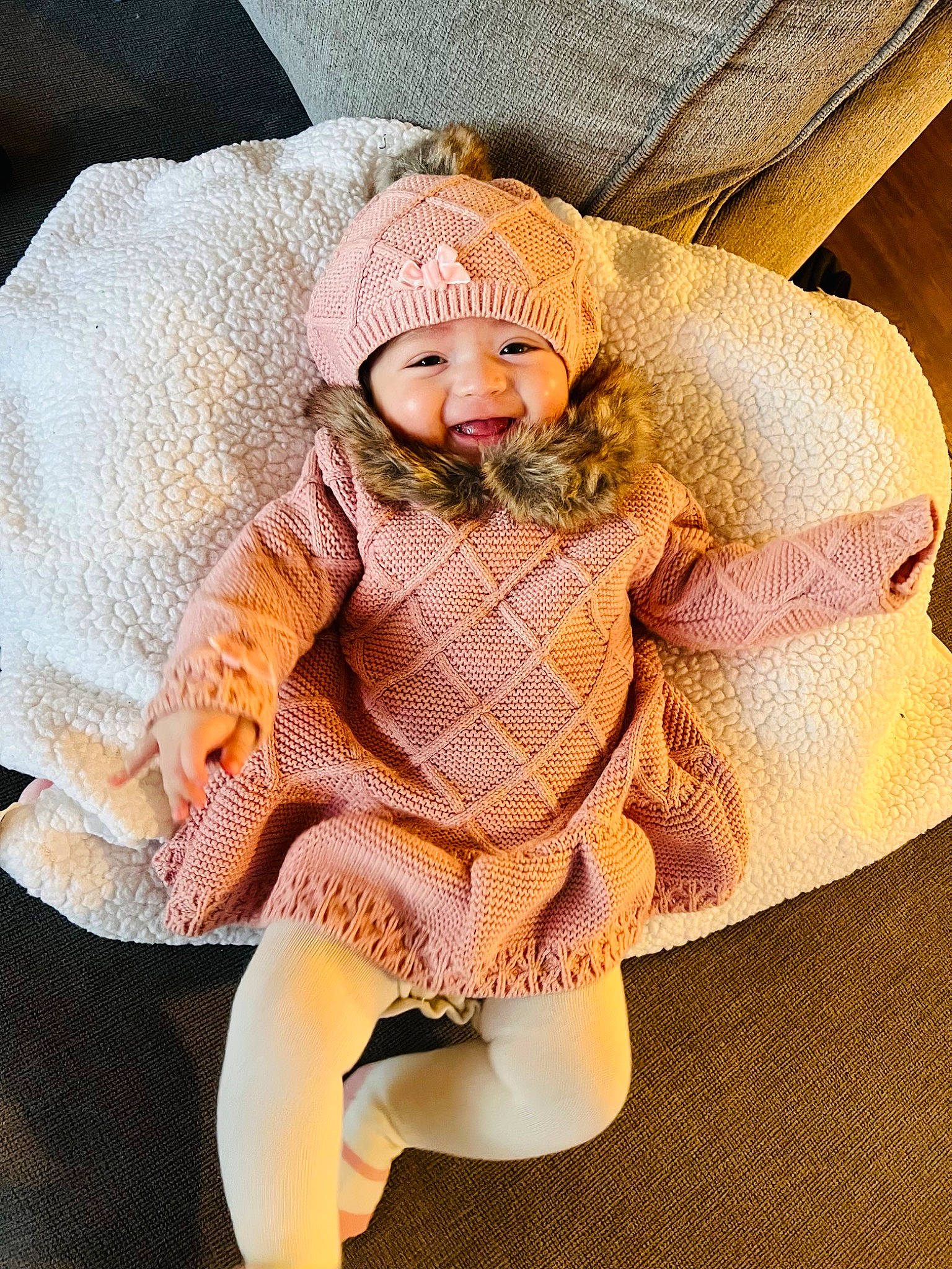 Ahlani is registered to the contest to win money with this photo: baby, baby_products, baby_sleeping, baby_toddler_clothing, cap, comfort, fashion_accessory, fur, hat, headgear, headwear, human_leg, knit_cap, pattern, peach, person, sitting, sleeve, thigh, toddler