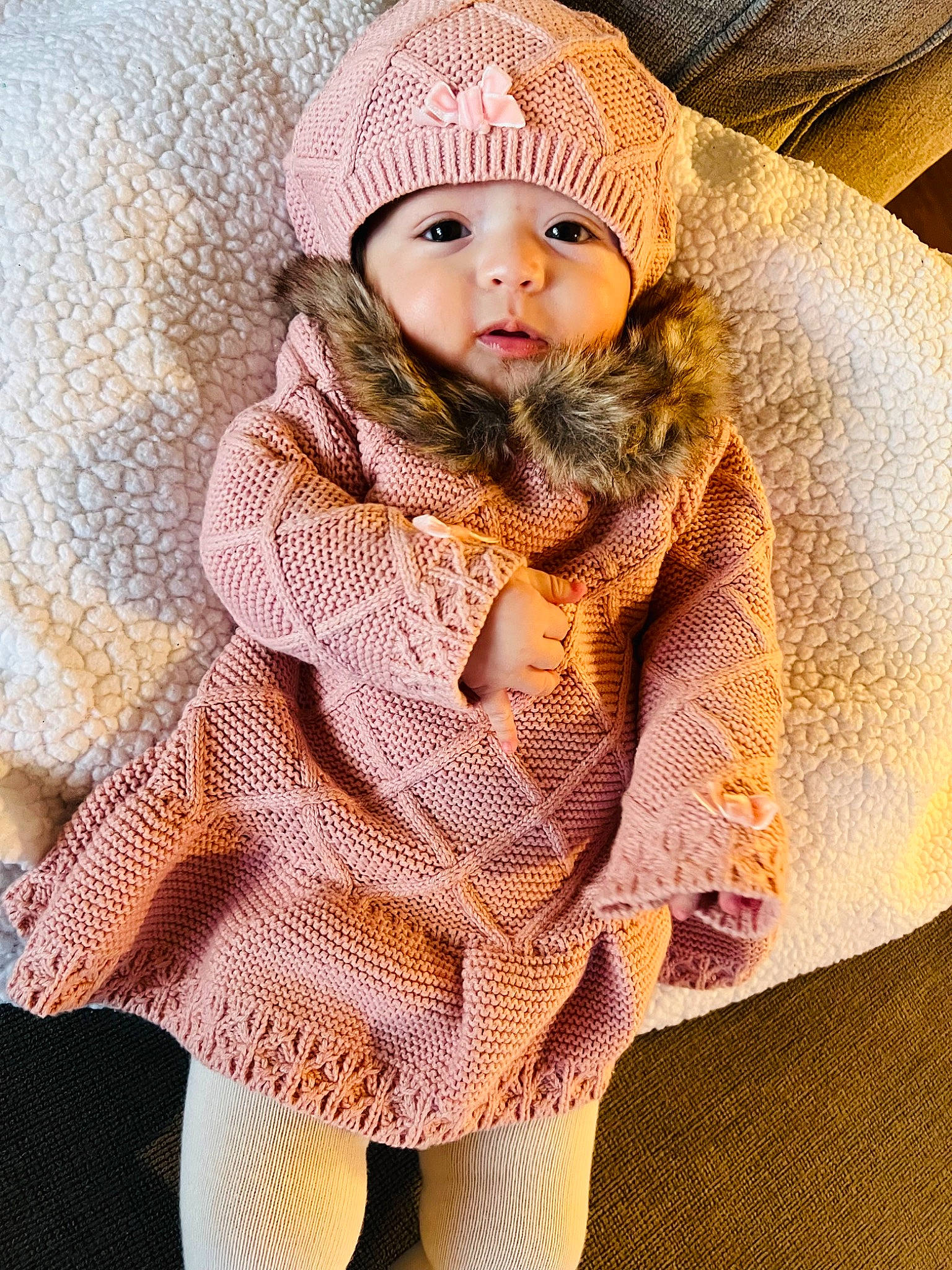 Ahlani joined the competition — help win amazing prizes! baby, baby_toddler_clothing, cap, cheek, child, clothing, collar, eye, face, fur, fur_clothing, headwear, knit_cap, outerwear, pattern, person, skin, sleeve, textile, toddler