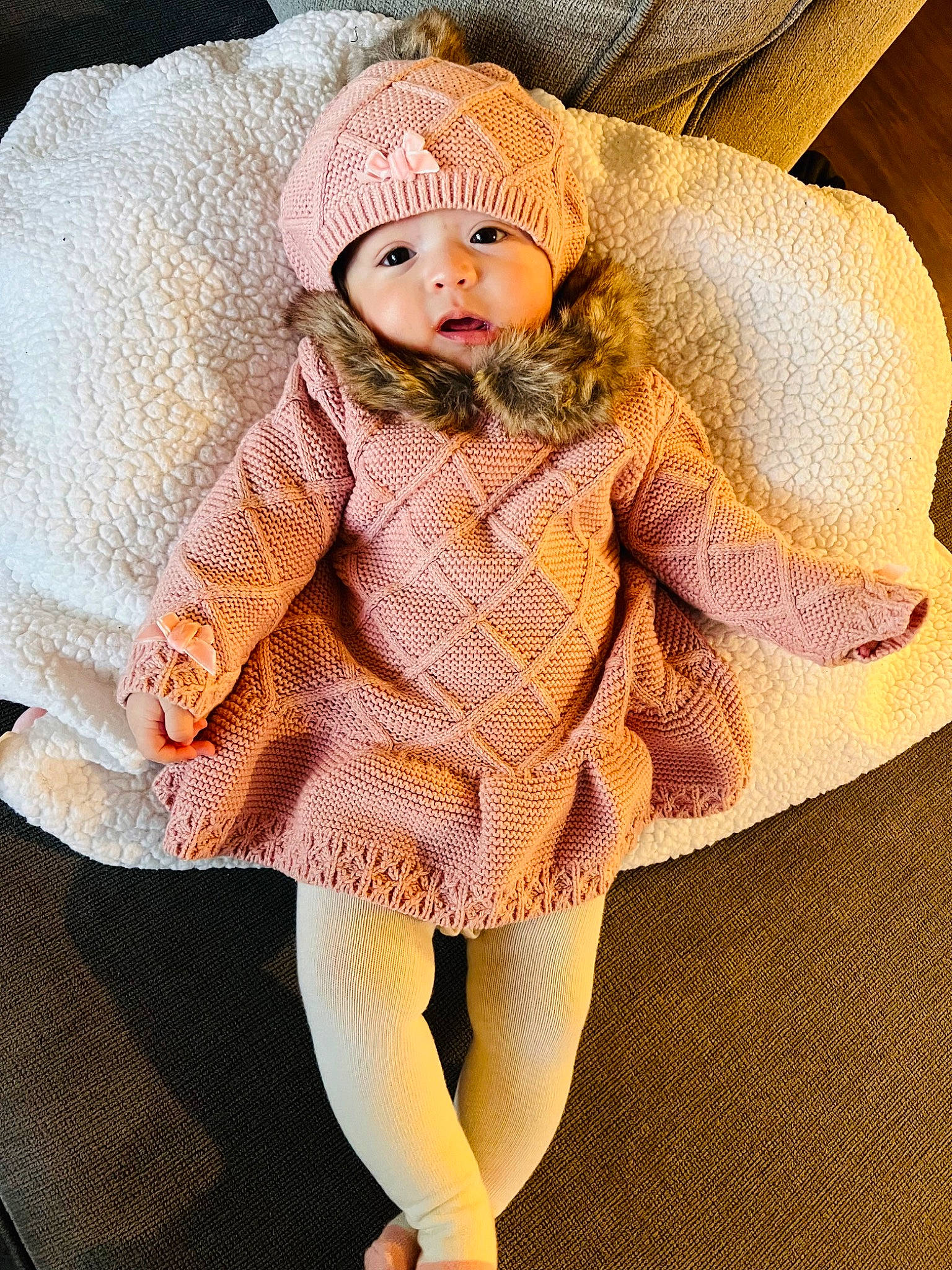 Ahlani joined the competition — help win amazing prizes! baby, baby_toddler_clothing, cap, doll, dress, eye, face, fashion_design, hat, head, headwear, human_body, human_leg, linens, pattern, person, plant, sleeve, textile, thigh