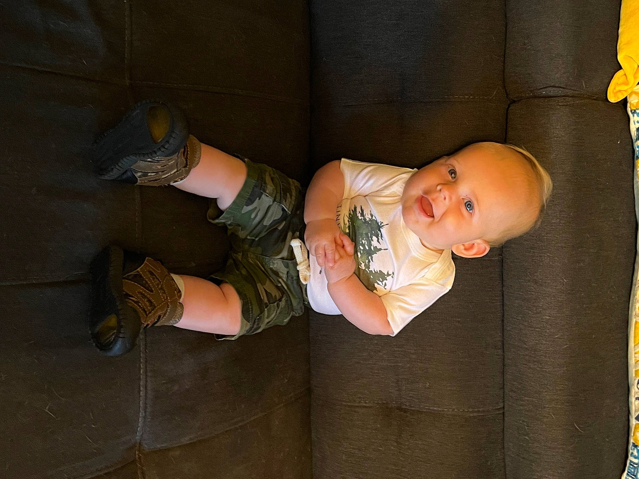 Sterling is registered to the contest to win money with this photo: baby, baby_products, baby_toddler_clothing, child, comfort, finger, foot, hand, human_leg, knee, leg, person, room, sitting, skin, sock, thigh, toddler, walking_shoe, wood