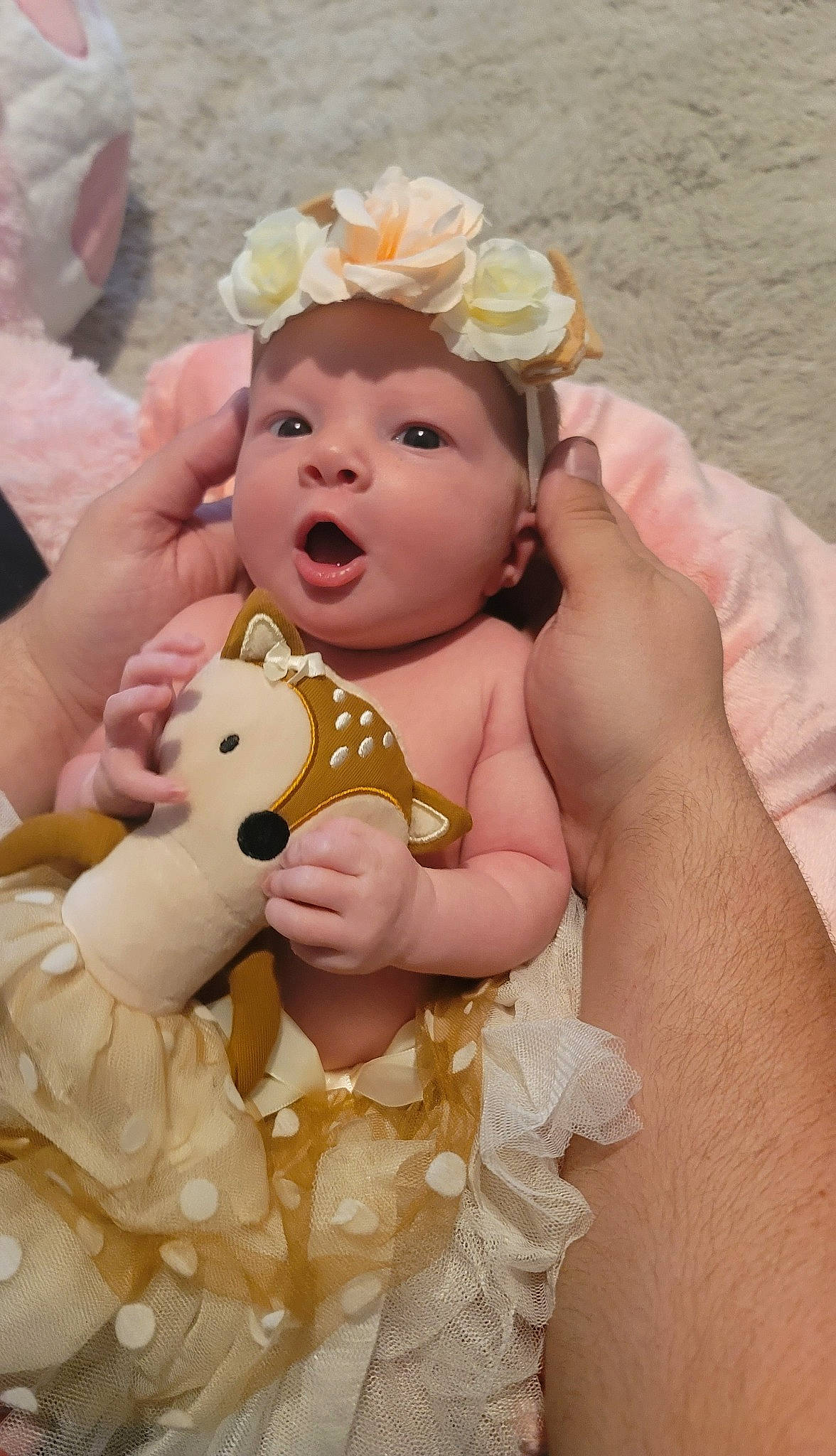 Alexandria joined the competition — help win amazing prizes! baby, baby_toddler_clothing, finger, flower, gesture, hand, happy, head, headgear, headpiece, lip, nail, person, petal, pink, skin, surprise, teddy_bear, thumb, toddler