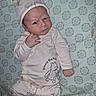 Korbyn is registered to the contest to win money with this photo: baby, infant, child, portrait, face, eyes, smiling, hat, onesie, clothing, winnie_the_pooh, blanket, bed, lying_down, indoor, patterned_background, hand, newborn, cute, photograph