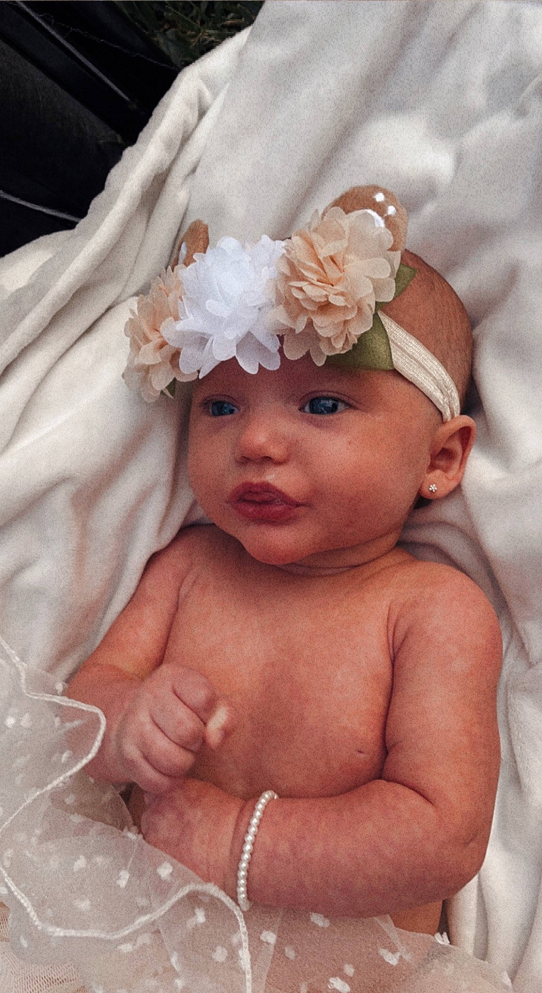 Paisley is registered to the contest to win money with this photo: baby, baby_toddler_clothing, bridal_accessory, cheek, chest, chin, eyebrow, flower, hand, head, headband, headgear, headpiece, headwear, iris, lip, neck, person, petal, pink
