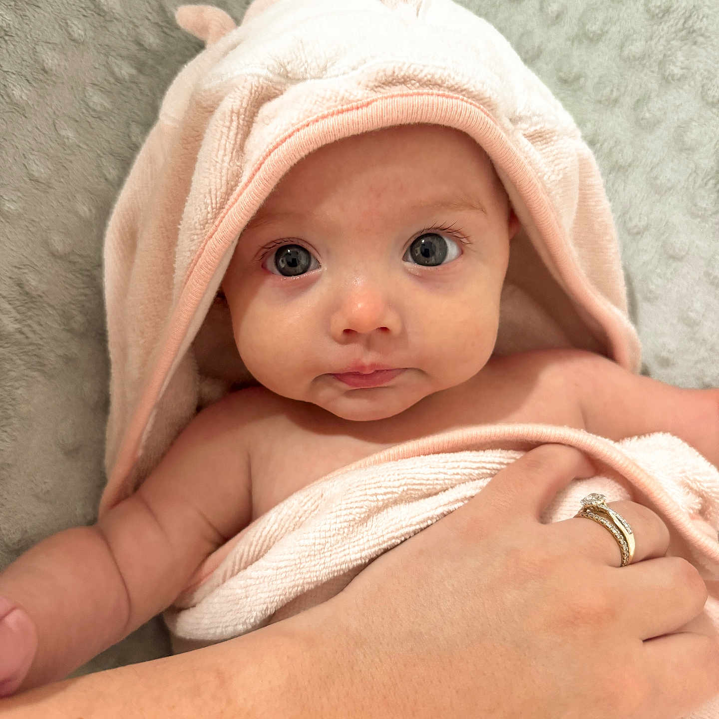 Bryer Ann is registered to the contest to win money with this photo: accessories, baby, blanket, bodypart, bonnet, cap, clothing, face, finger, hand, hat, head, hood, jewelry, newborn, person, photography, portrait, ring, towel