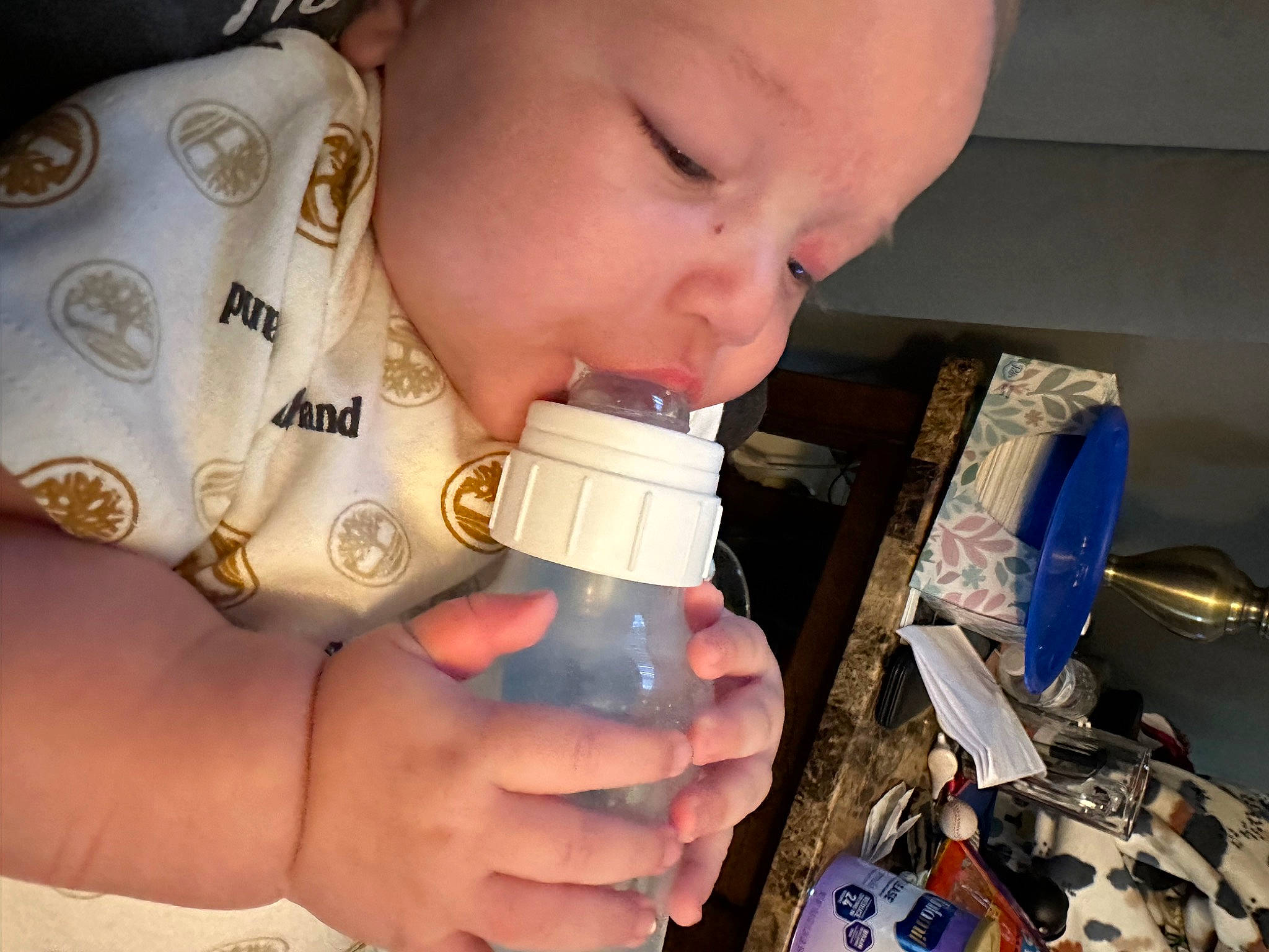 Ayden is registered to the contest to win money with this photo: baby, baby_bottle, baby_products, baby_toddler_clothing, bottle, child, drink, drinking, drinkware, eyelash, finger, fluid, hand, headwear, nail, person, plastic_bottle, science, skin, thumb