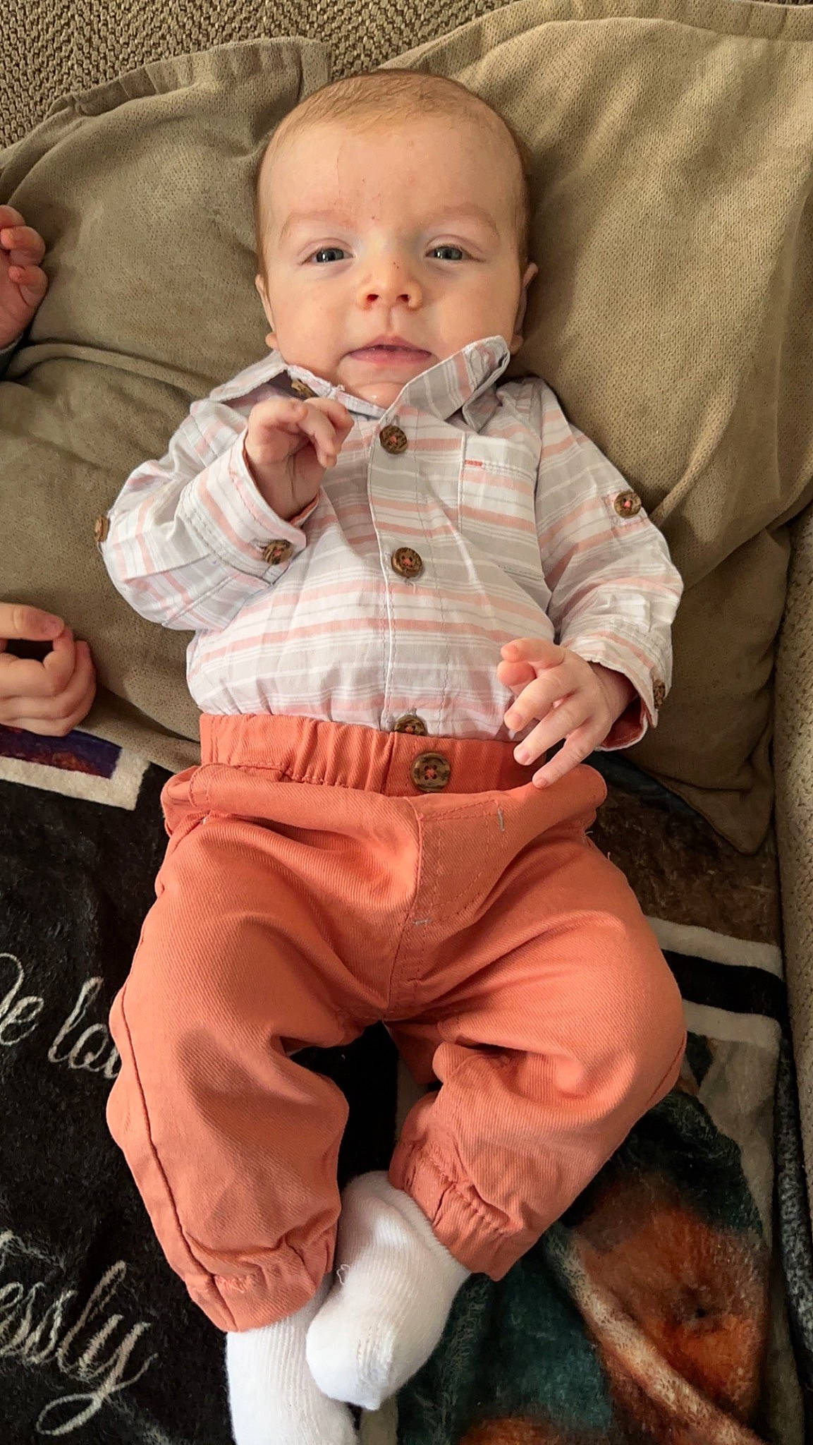 Cash is registered to the contest to win money with this photo: baby, baby_toddler_clothing, cheek, collar, comfort, eye, gesture, happy, head, human, iris, mouth, nose, people, person, pink, sitting, skin, sleeve, smile