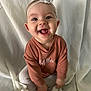 Miller joined the competition — help win amazing prizes! baby, smiling, headband, flower, sweater, embroidery, child, cute, portrait, sitting, fabric, cloth, hands, happy, infant, person, indoor, cute_expression, closeup, playful