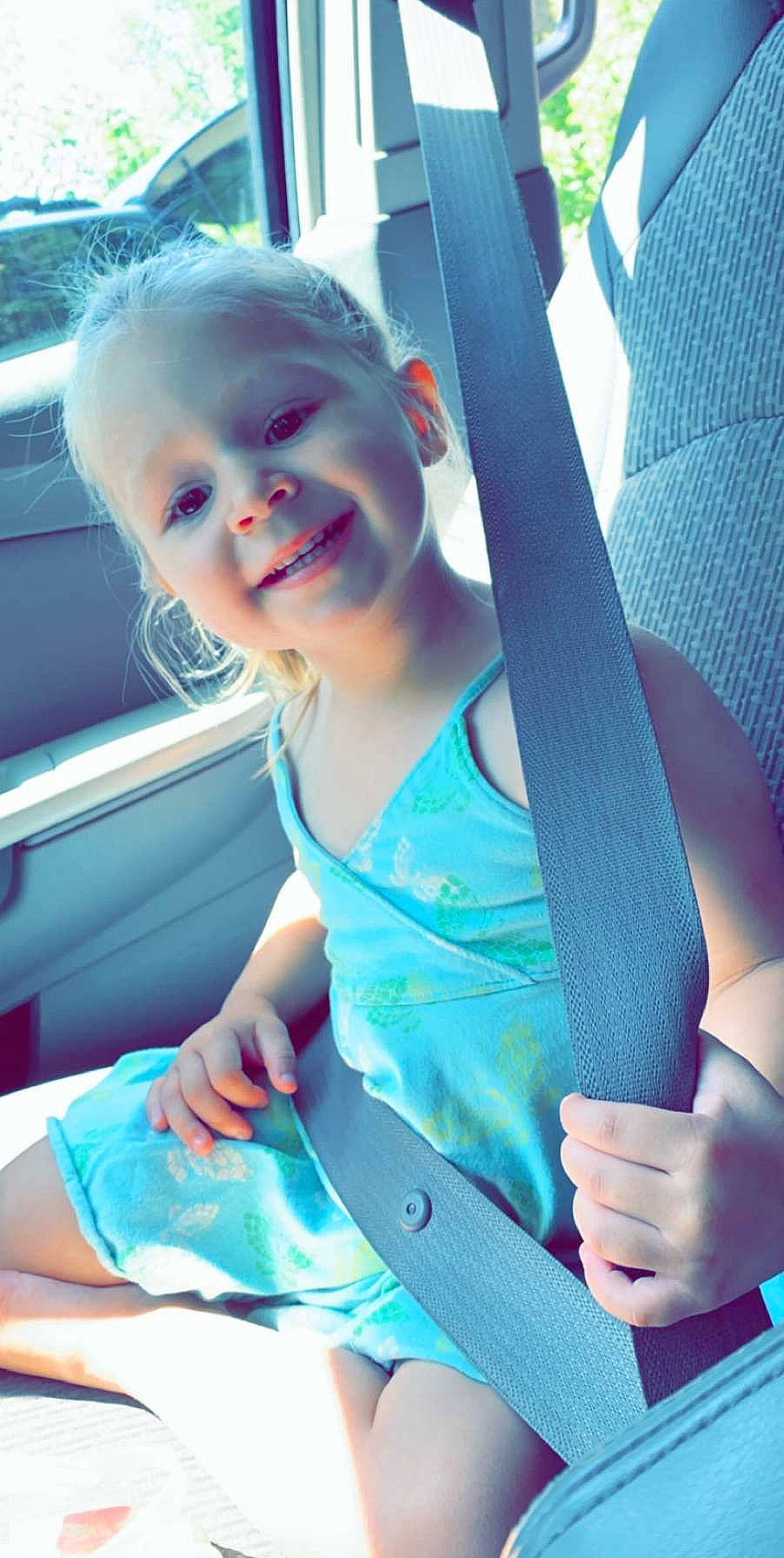 Myah joined the competition — help win amazing prizes! auto_part, baby, car, car_seat, child, joy, person, seat_belt, smile, summer, toddler, turquoise, vacation
