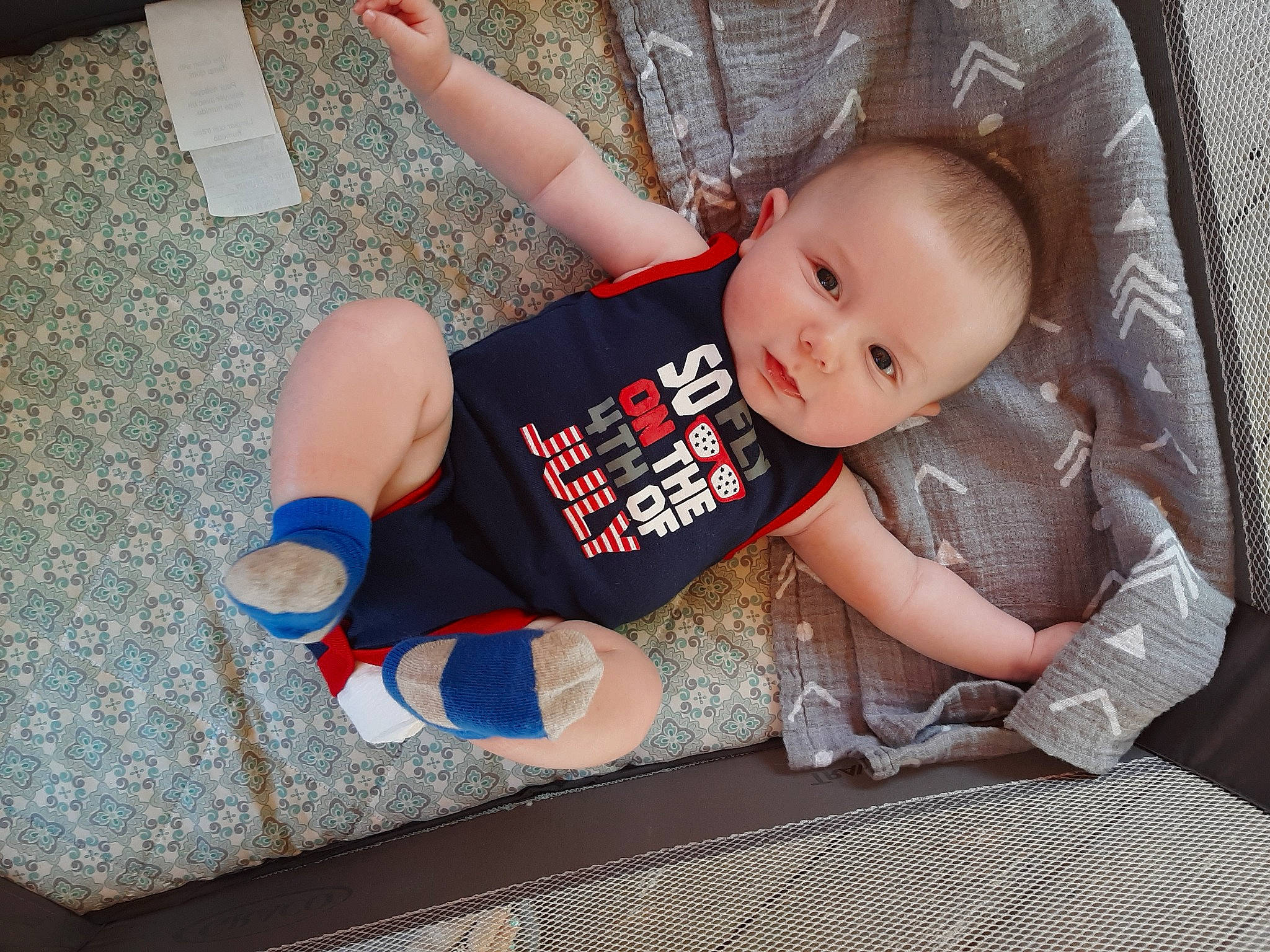 Bradyn joined the competition — help win amazing prizes! arm, baby, baby_products, baby_toddler_clothing, child, comfort, finger, floor, flooring, foot, hand, human_leg, leg, pattern, person, sitting, sleeve, sock, textile, thigh
