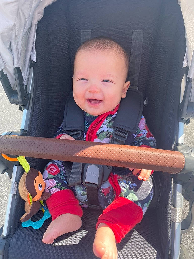 Manila is registered to the contest to win money with this photo: auto_part, baby, baby_carriage, baby_products, baby_safety, baby_toddler_clothing, chair, cheek, child, comfort, electric_blue, face, finger, fun, happy, infant_bed, person, sitting, skin, smile