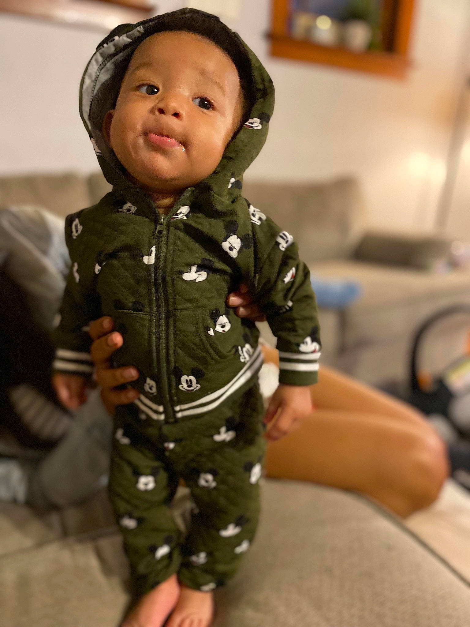 Adonis is registered to the contest to win money with this photo: baby, baby_toddler_clothing, button, camouflage, cheek, child, collar, comfort, dress_shirt, eye, military_camouflage, pattern, person, picture_frame, room, sitting, skin, sleeve, smile, toddler