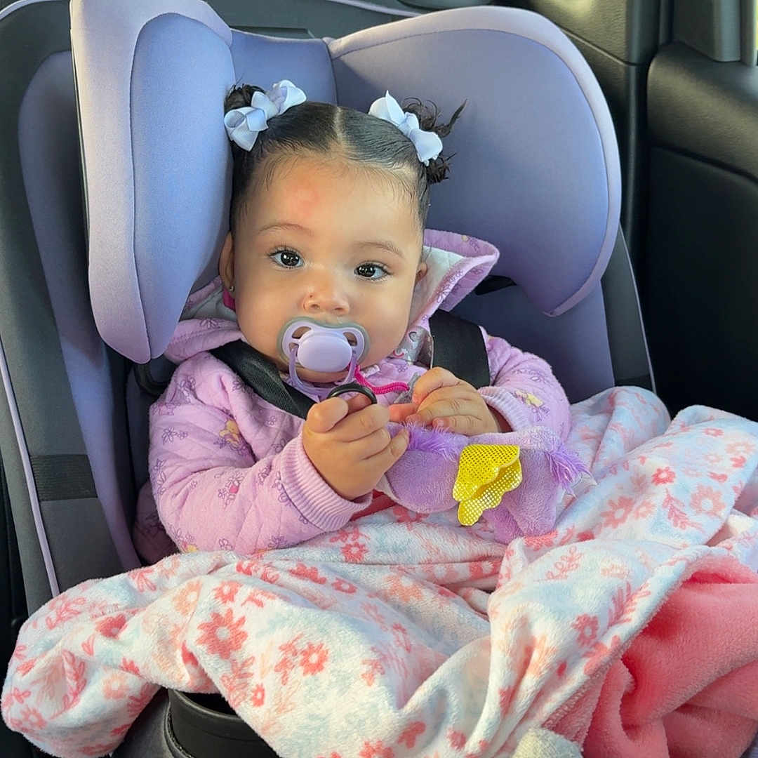 Ahlenah joined the competition — help win amazing prizes! baby, blanket, car, car_interior, carseat, clothing, cushion, cutlery, face, hat, head, headrest, homedecor, person, photography, portrait, purple, sitting, transportation, vehicle