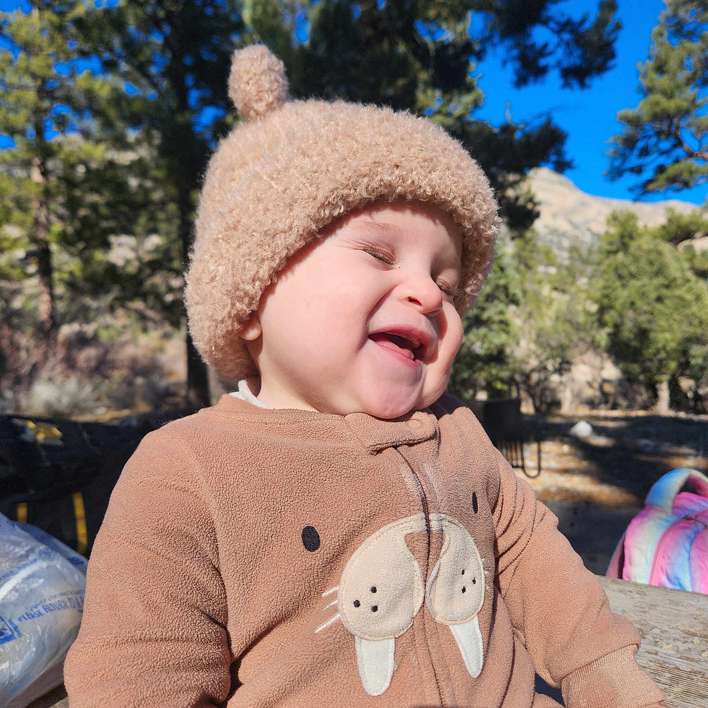 Max joined the competition — help win amazing prizes! child, toddler, smiling, outdoor, sunny, hat, brown_clothing, onesie, walrus_design, trees, nature, blue_sky, happy, laughing, person, daylight, cute, playful, warm_clothing, park