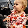 toddler, child, halloween, pumpkin, dress, orange, ghost, jack_o_lantern, toy_car, police, vintage, portrait, smile, cute, costume, indoor, face, hands, blue_eyes, blonde_hair