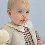 Isabelle is registered to the contest to win money with this photo: toddler, child, blue_eyes, blonde_hair, fur_vest, checkered_dress, knitted_toy, soft_lighting, portrait, indoor, cute, young_child, closeup, baby, innocence, fashion, person, clothing, toy, studio