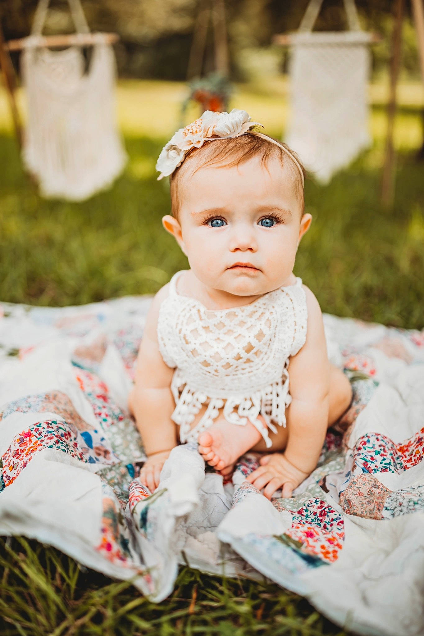 Astrid joined the competition — help win amazing prizes! baby, baby_toddler_clothing, child, dress, embellishment, event, fashion_accessory, flash_photography, grass, happy, head, headband, headpiece, iris, jewellery, necklace, peach, person, sitting, skin