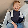 Naël participe au concours pour gagner de l'argent avec cette photo : child, boy, smiling, sitting, chair, indoor, cross_legged, casual_clothing, jeans, socks, blonde_hair, happy, portrait, person, jacket, turtleneck, home, young, cute, relaxed