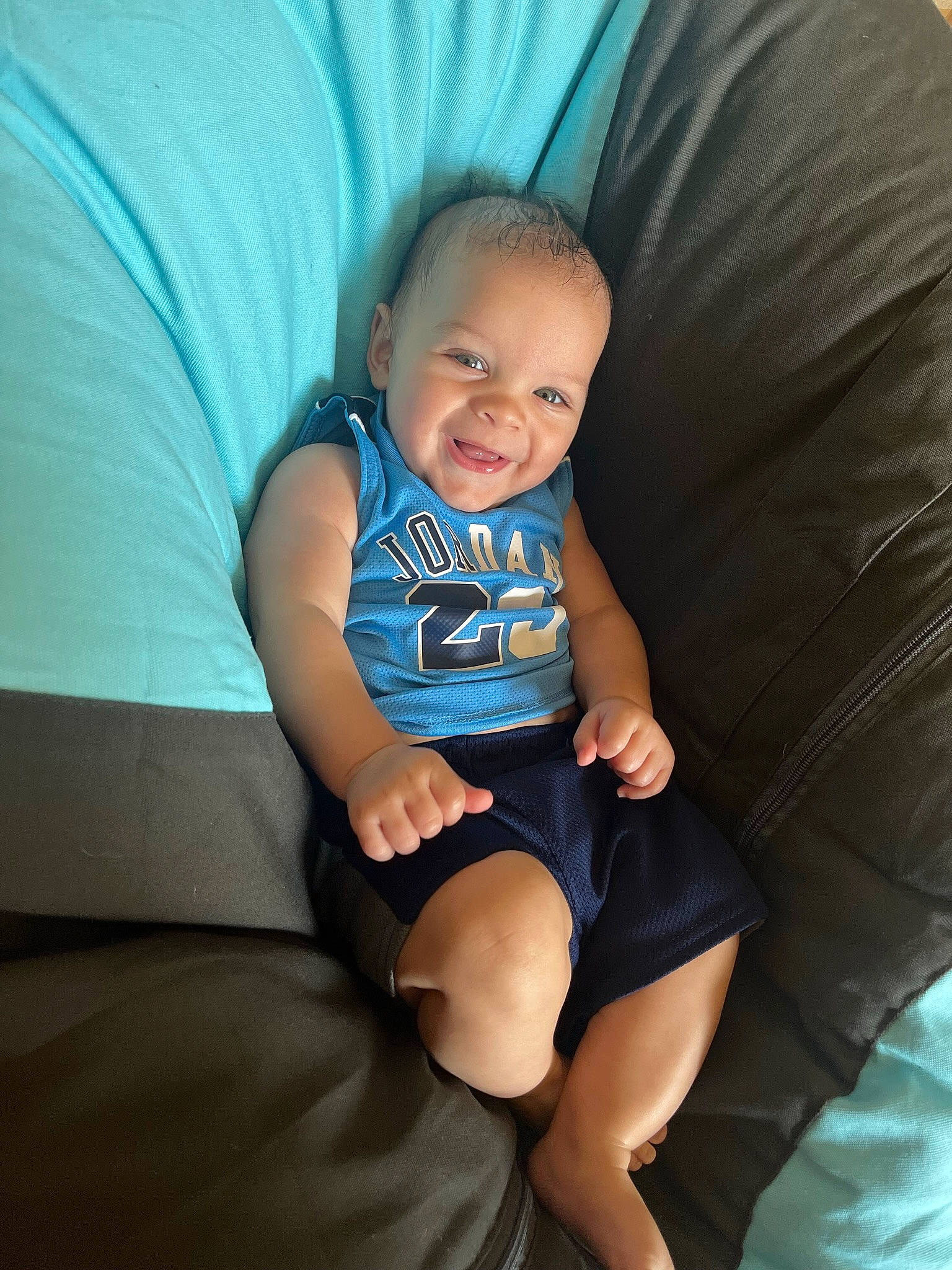 Koby joined the competition — help win amazing prizes! arm, azure, comfort, couch, elbow, eye, finger, flash_photography, hairstyle, hand, happy, human_body, joy, knee, lap, leg, mouth, person, shorts, shoulder