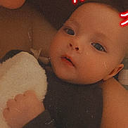 Rowen joined the competition — help win amazing prizes! baby, infant, adult_partial_face, neon_horns, filter, blanket, close_up, portrait, soft_light, vintage_filter, grainy, cozy, hand, eyes, cheeks, smile, snuggle, bedtime, warm_tone, plush