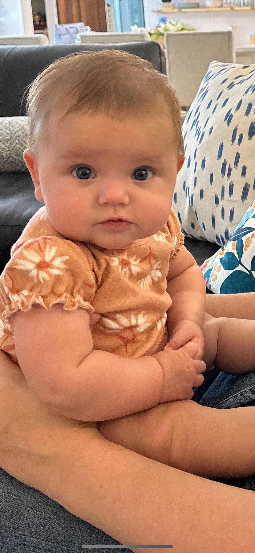 Alice is registered to the contest to win money with this photo: arm, baby_toddler_clothing, cheek, comfort, face, finger, gesture, hair, hand, human_body, iris, joint, lip, mouth, neck, nose, person, shoulder, skin, sleeve