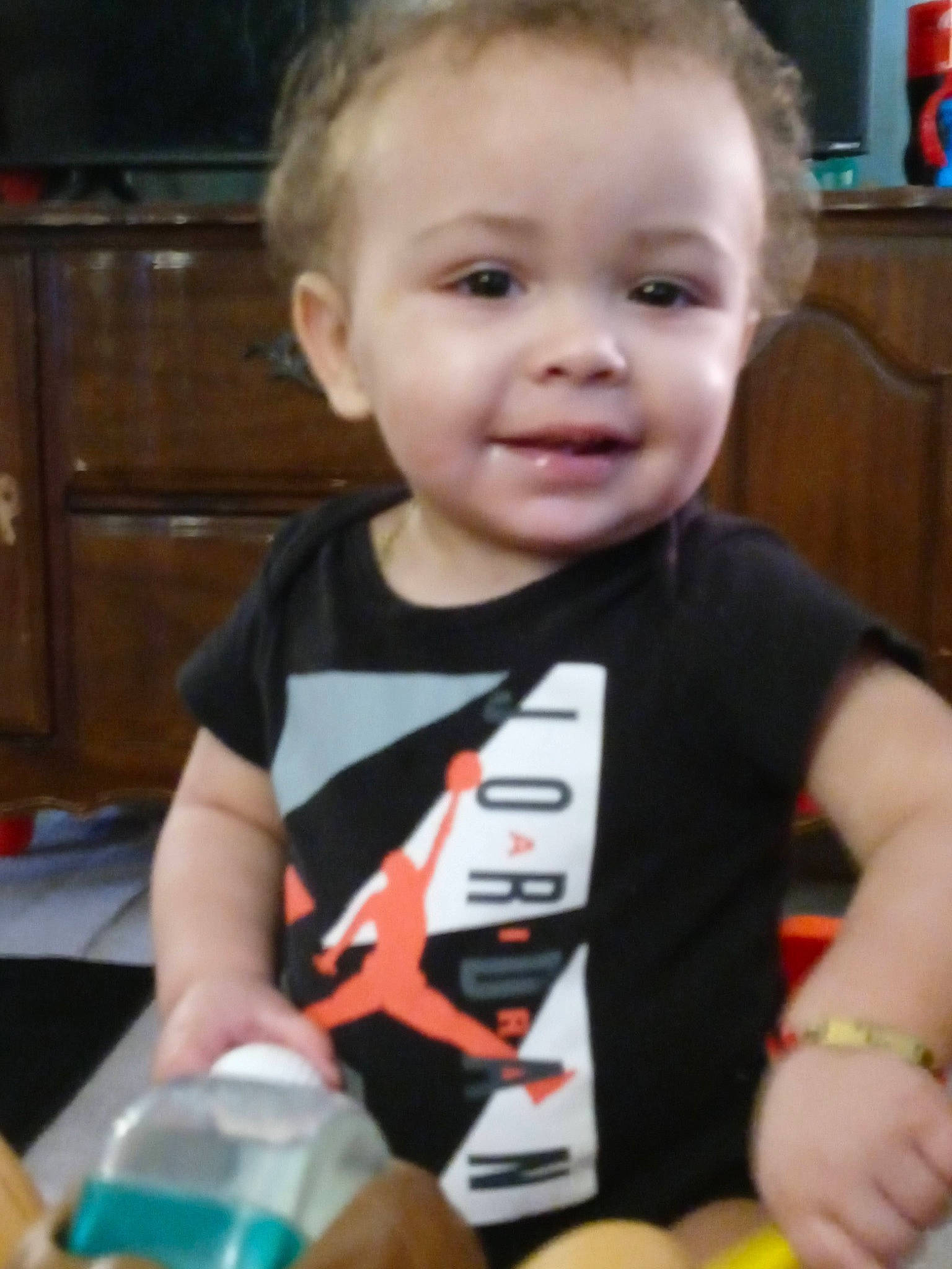 Jordan joined the competition — help win amazing prizes! baby, baby_toddler_clothing, cabinetry, cheek, child, elbow, event, face, fun, happy, person, plastic_bottle, play, shelf, sitting, skin, smile, t_shirt, toddler, water_bottle