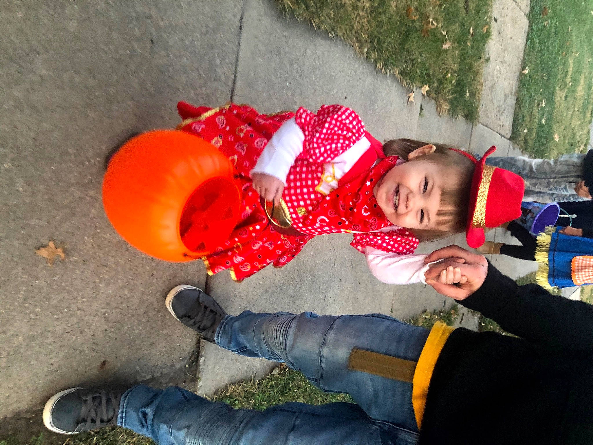 Kalliopë joined the competition — help win amazing prizes! baby, boot, carmine, child, clothing, facial_expression, fun, grass, hat, human_leg, joy, lap, leisure, orange, person, plant, play, recreation, sitting, toddler